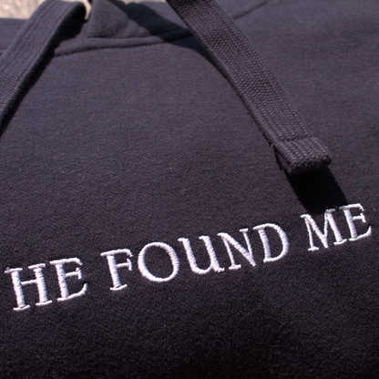 Navy blue hoodie with embroidered 'HE FOUND ME' text in white
